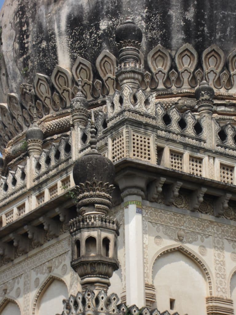 A carved stone corner of the Quli Qutb Shah Tomb.